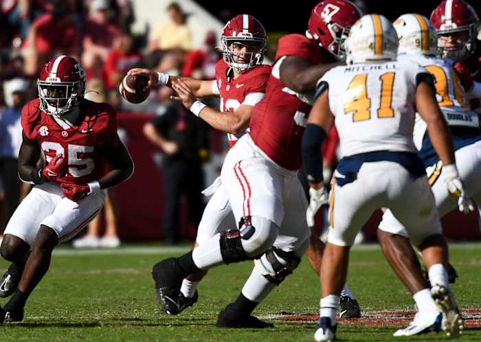 Nov 18, 2023; Tuscaloosa, Alabama, USA; Alabama Crimson Tide quarterback Dylan Lonergan (12) throws against the the Chattanooga Mocs at Bryant-Denny Stadium. Alabama won 66-10. Mandatory Credit: Gary Cosby Jr.-USA TODAY Sports